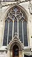 The five-light window with reticulated ogee arches above the doorway of the north aisle