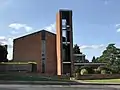 St Michael and All Saints Roman Catholic Church, built 1961-4 by Henry Bingham Towner and officially opened by Archbishop Cyril Cowderoy