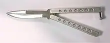 A butterfly knife with steel handles and lightening holes.