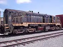 The 1811 was built for the U.S. Army by EMD. It is an EMD MRS-1 class locomotive that has adjustable gauge trucks to run in Europe and Russia. Now it belongs to the museum at Fort Eustis, but sits abandoned in Hanks Yard.