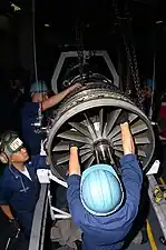 Variable inlet guide vanes are used on modern engines. Variable trailing edge flaps, colored brown, are visible on this General Electric F414.