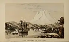 A white mountain rising over a forested bay with a ship