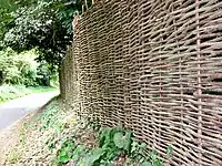 Wicker fence with the sort of weave imitated in the "old osier" pattern