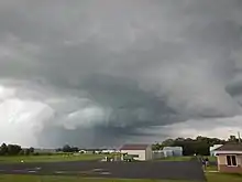 A small airport on a very cloudy day