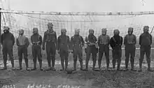 Football team of British soldiers with gas masks, Western front, 1916